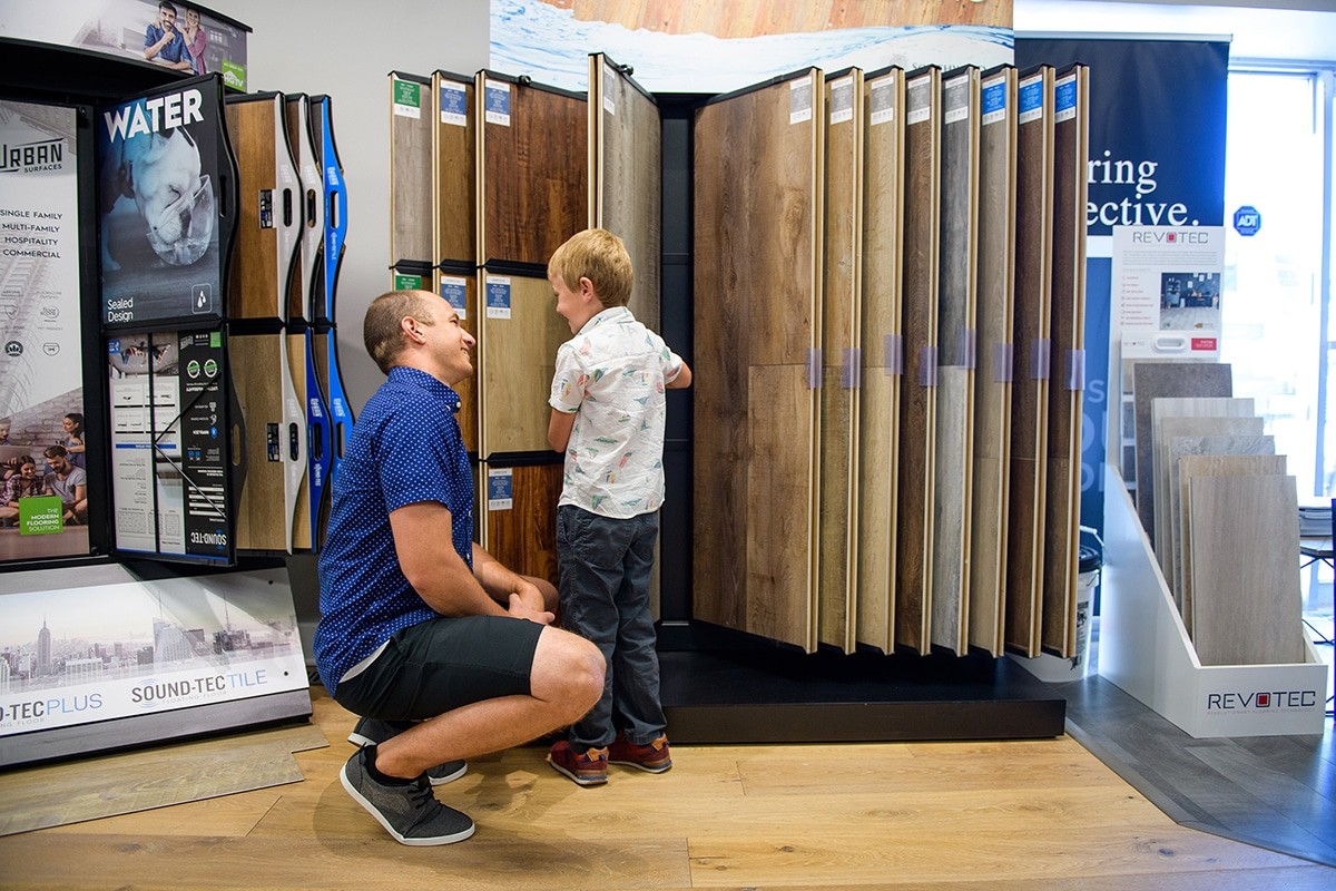 home collective customer looking at flooring options with his son